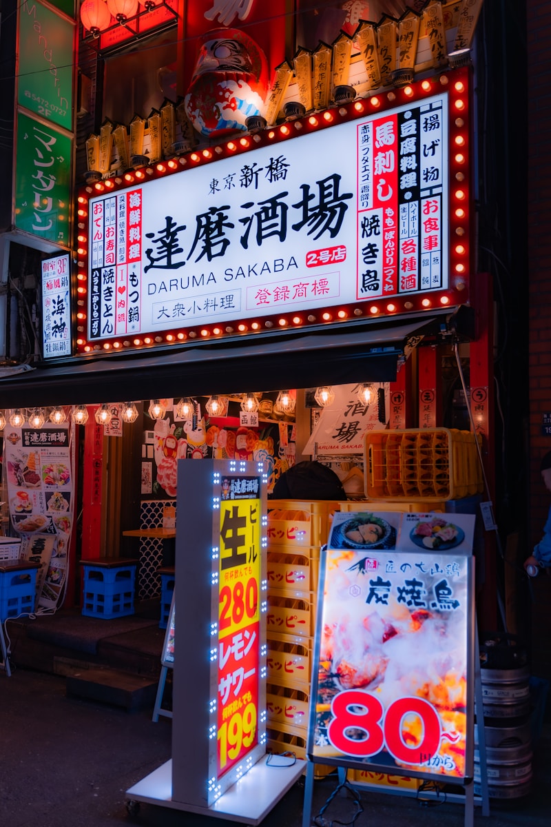 a chinese restaurant with neon signs on the side of it