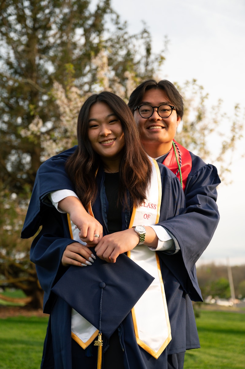 a couple of people that are standing in the grass