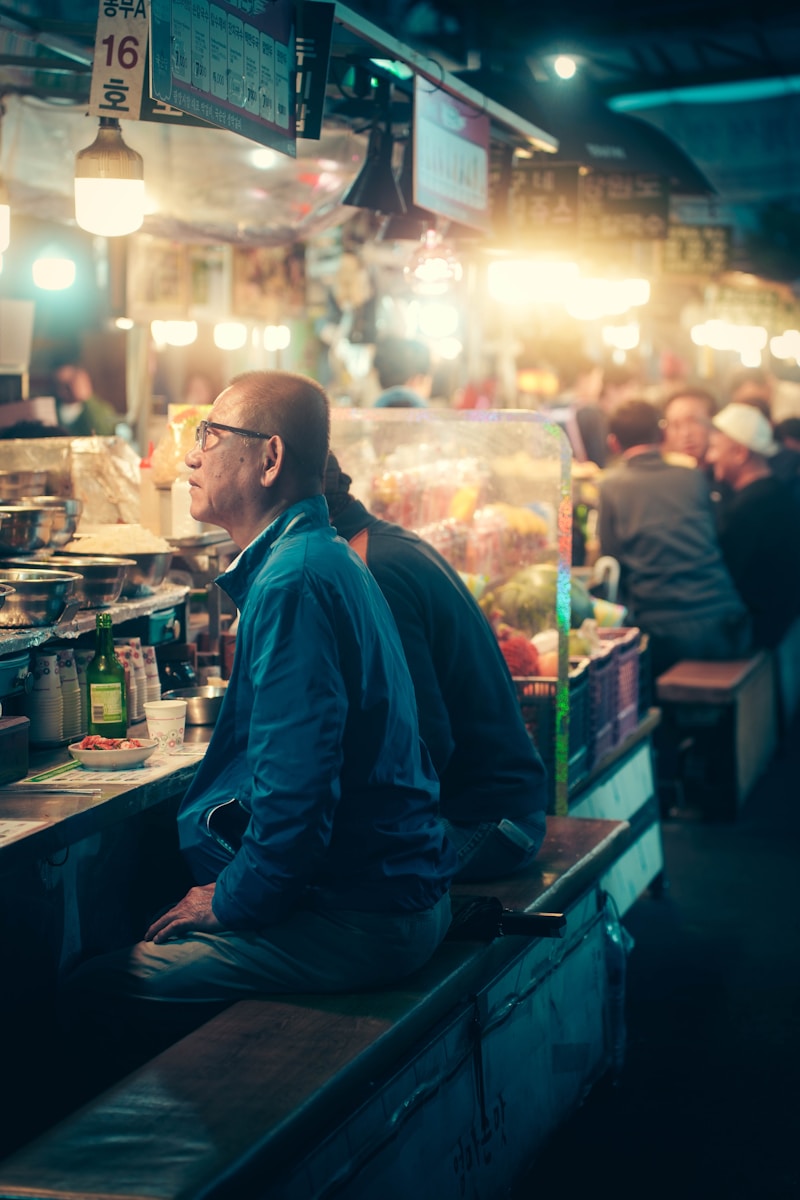 A man sitting at a bar in a restaurant